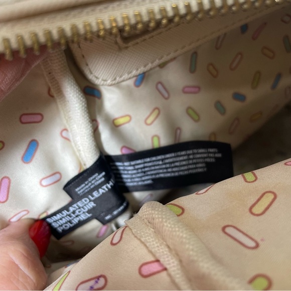 Loungefly Disney mini backpack. Donuts!! Used. Slight stains in lining. See pic - Picture 8 of 11